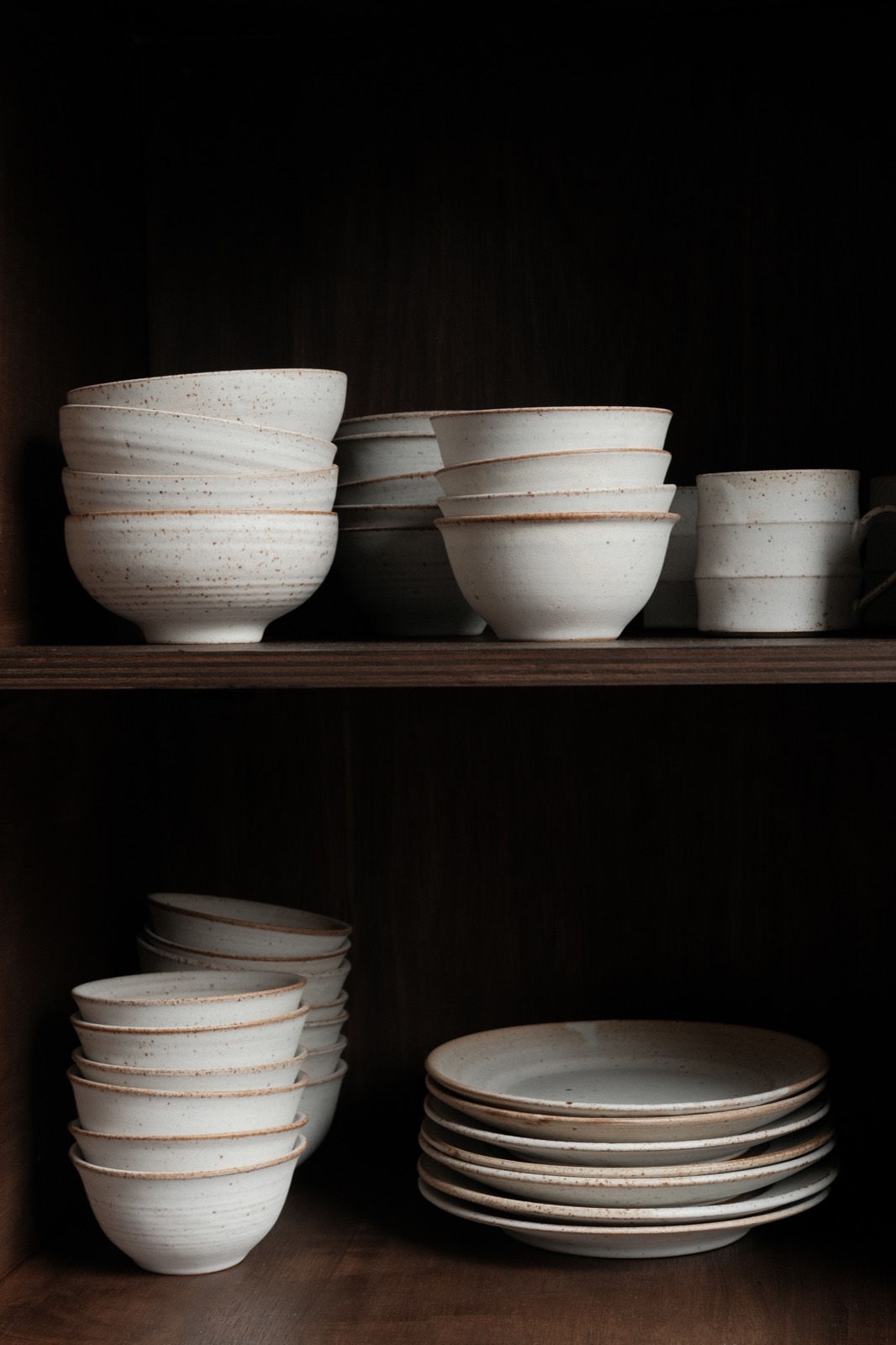 Speckled stoneware bowls and plates